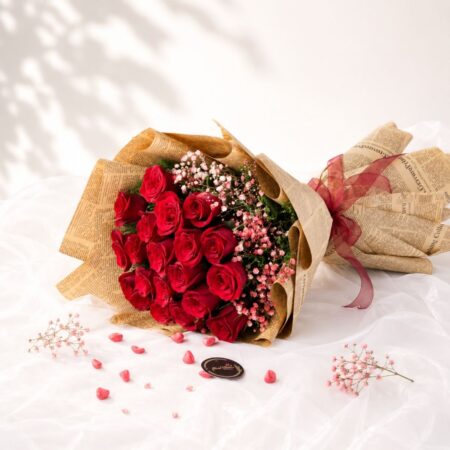 Luxury bouquet of premium red roses with pink baby's breath for same day flower delivery in Bangalore.