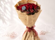 Crimson Sky red rose bouquet with baby's breath wrapped in kraft paper, Bangalore flower delivery