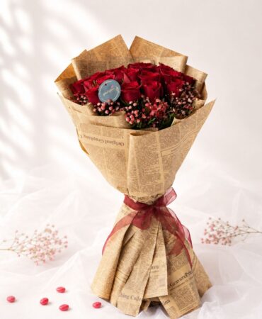 Crimson Sky red rose bouquet with baby's breath wrapped in kraft paper, Bangalore flower delivery