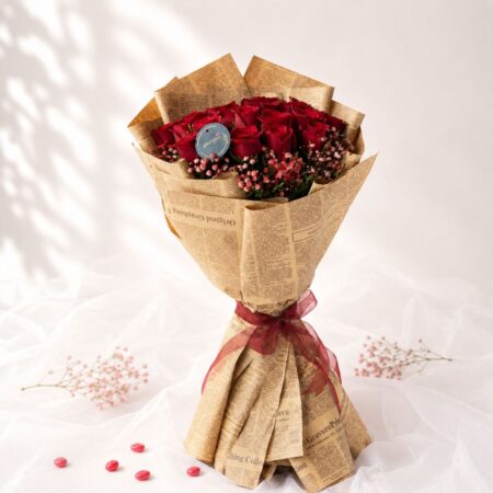 Luxury bouquet of premium red roses with pink baby's breath for same day flower delivery in Bangalore.