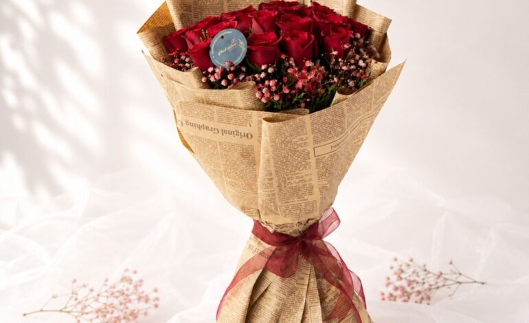 Crimson Sky red rose bouquet with baby's breath wrapped in kraft paper, Bangalore flower delivery