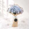 Elegant blue hydrangea bouquet with lavender baby's breath for premium flower delivery in Bangalore.
