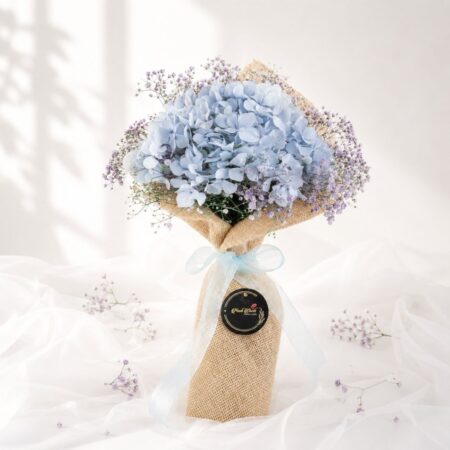 Elegant blue hydrangea bouquet with lavender baby's breath for premium flower delivery in Bangalore.