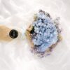 Elegant blue hydrangea bouquet with lavender baby's breath for premium flower delivery in Bangalore.