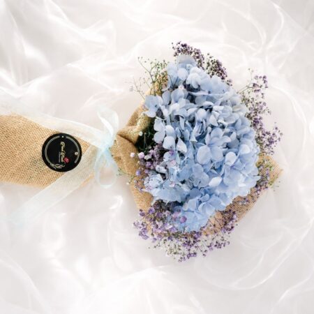 Elegant blue hydrangea bouquet with lavender baby's breath for premium flower delivery in Bangalore.