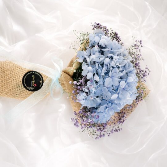 Elegant blue hydrangea bouquet with lavender baby's breath for premium flower delivery in Bangalore.