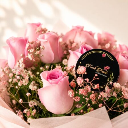 A bouquet of pink roses with a Ferrero Rocher box, available for same day delivery across Bangalore.
