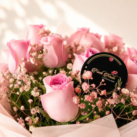A bouquet of pink roses with a Ferrero Rocher box, available for same day delivery across Bangalore.