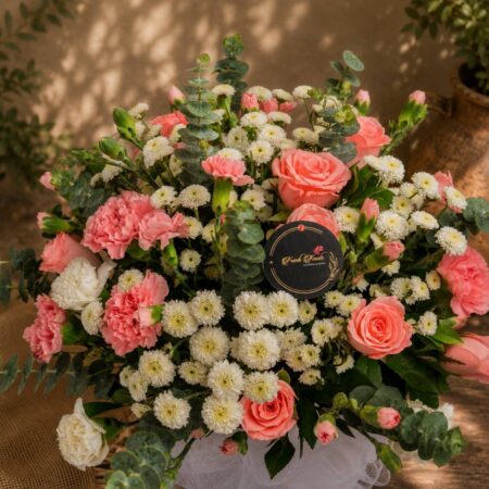 Premium pink rose, carnation, and chrysanthemum floral arrangement for online flower delivery in Bangalore.