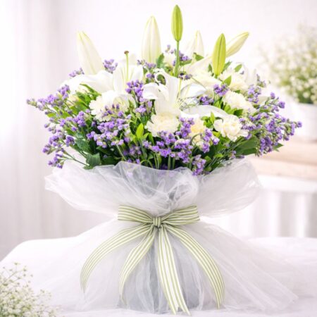 Luxury white lily and purple flower bouquet with roses for same day flower delivery Bangalore by premium florist FreshKnots.