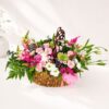 Pastel flower basket Bangalore with roses eustoma carnations and seasonal blooms for same day flower delivery