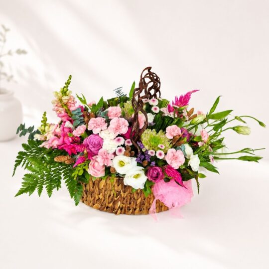 Pastel flower basket Bangalore with roses eustoma carnations and seasonal blooms for same day flower delivery