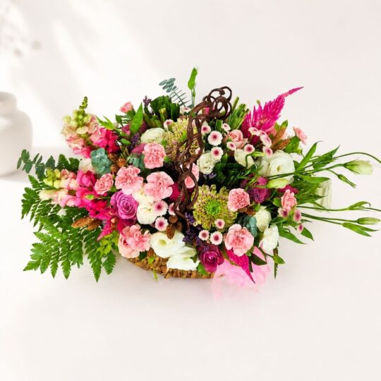 Pastel flower basket Bangalore with roses eustoma carnations and seasonal blooms for same day flower delivery
