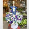 Hamper with Flowers and Non-alcoholic grape juice bottle