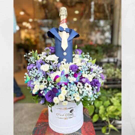 Hamper with Flowers and Non-alcoholic grape juice bottle