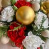 Christmas floral arrangement in glass vase with red white flowers and gold accents by premium florist in Bangalore