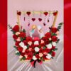 Valentine gift with red roses and porcelain couple statue