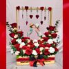 Valentine gift with red roses and porcelain couple statue