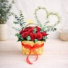 Red rose basket arrangement with heart design for same day flower delivery Bangalore by premium florist.
