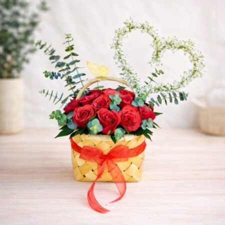 Red rose basket arrangement with heart design for same day flower delivery Bangalore by premium florist.