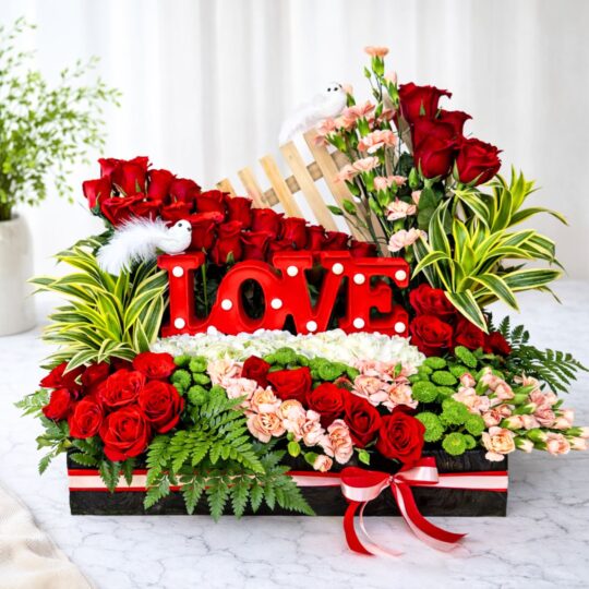 Valentine flower arrangement with red roses and LOVE sign - same day flower delivery Bangalore
