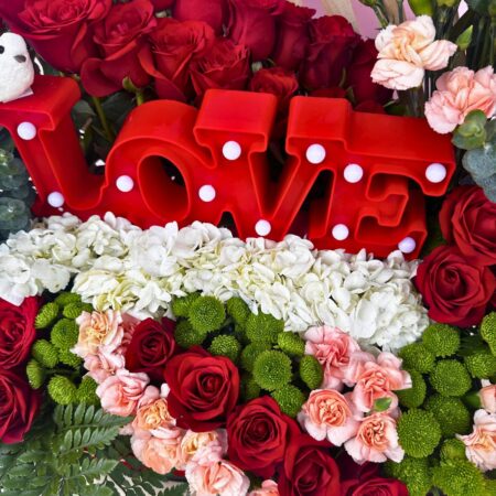 Valentine flower arrangement with red roses and LOVE sign - same day flower delivery Bangalore