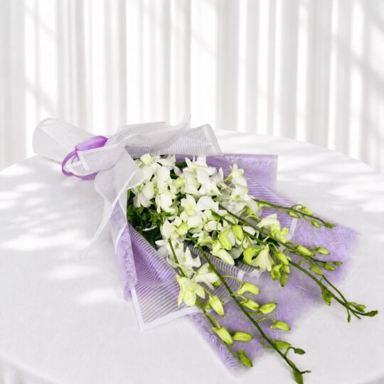 White orchid bouquet in lilac wrap for same day flower delivery Bangalore
