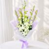 White orchid bouquet in lilac wrap for same day flower delivery Bangalore