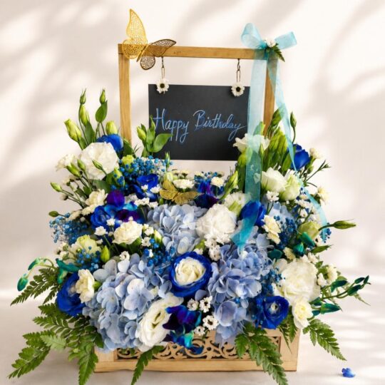 Blue hydrangea birthday floral arrangement Bangalore with roses orchids and luxury flower setup