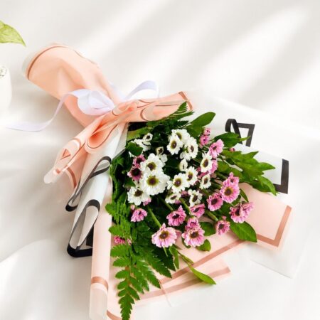 Colorful mixed flower bouquet with roses and fresh seasonal blooms wrapped in elegant pastel packaging for flower delivery in Bangalore.