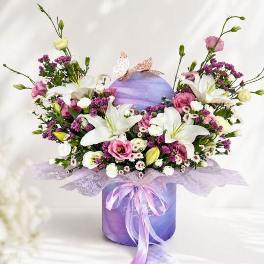 Luxury rainbow flower box arrangement with mixed fresh flowers in pastel shades for premium flower delivery in Bangalore.