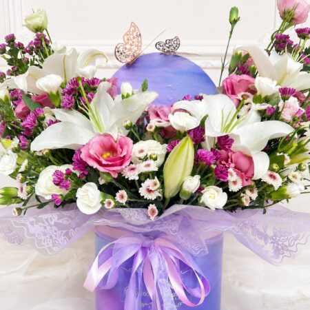 Luxury rainbow flower box arrangement with mixed fresh flowers in pastel shades for premium flower delivery in Bangalore.