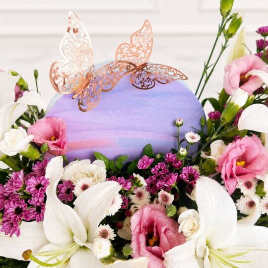 Luxury rainbow flower box arrangement with mixed fresh flowers in pastel shades for premium flower delivery in Bangalore.