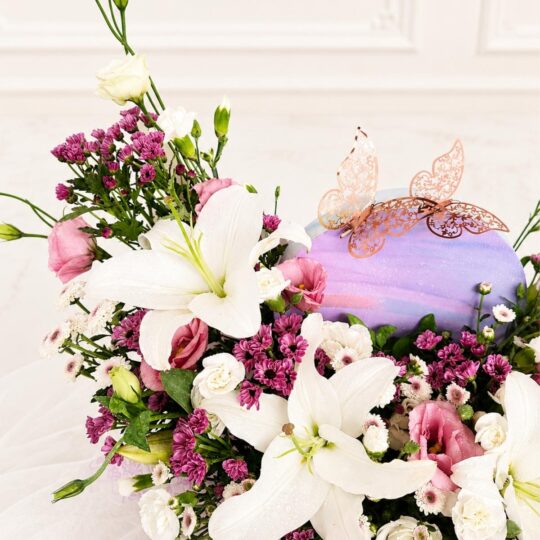 Luxury rainbow flower box arrangement with mixed fresh flowers in pastel shades for premium flower delivery in Bangalore.