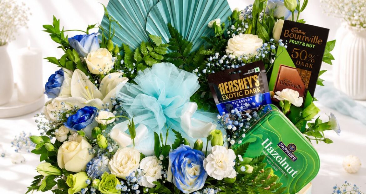Luxury cake and flower hamper with fresh flowers and gourmet treats for premium gifting in Bangalore.