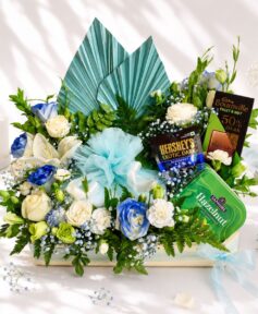 Luxury cake and flower hamper with fresh flowers and gourmet treats for premium gifting in Bangalore.