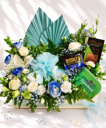 Luxury cake and flower hamper with fresh flowers and gourmet treats for premium gifting in Bangalore.