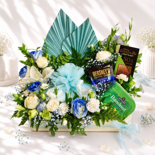 Luxury cake and flower hamper with fresh flowers and gourmet treats for premium gifting in Bangalore.