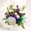 Luxury flower box arrangement by Freshknots Bangalore featuring white chrysanthemums, hydrangeas, purple asters, orchids, and roses in a premium floral gift box