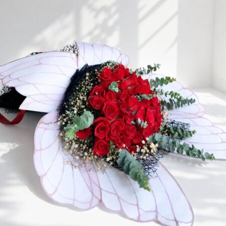 Luxury red rose bouquet with designer wrapping for same day flower delivery in Bangalore by FreshKnots