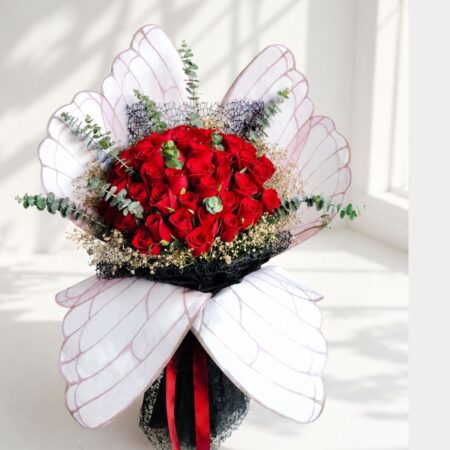 Luxury red rose bouquet with designer wrapping for same day flower delivery in Bangalore by FreshKnots