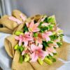 Pink lily bouquet wrapped in jute with green foliage – perfect for birthday gifts, anniversary flowers, and same day flower delivery in Bengaluru.