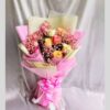 FreshKnots mixed rose bouquet with pink, yellow, and cream roses wrapped in designer paper – available for same day flower delivery in Bengaluru.