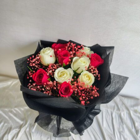 Elegant red and white rose bouquet with pink fillers in black wrapping – Bangalore flower delivery