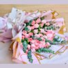 Elegant bouquet of blush pink roses in premium artistic wrapping