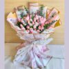 Elegant bouquet of blush pink roses in premium artistic wrapping