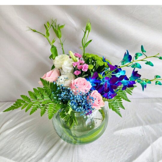 Exotic fishbowl flower arrangement with blue orchids, pink roses, and eustoma – same-day delivery in Bangalore by FreshKnots