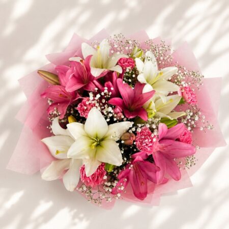 Luxury bouquet of pink lilies and carnations with elegant wrapping for premium flower delivery in Bangalore.