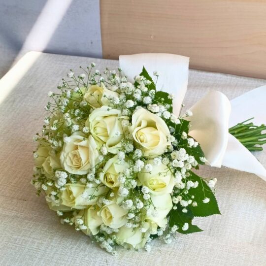 Elegant white rose bridal bouquet with baby’s breath — same-day delivery in Bangalore.