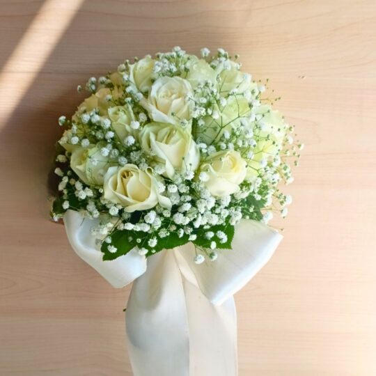 Elegant white rose bridal bouquet with baby’s breath — same-day delivery in Bangalore.